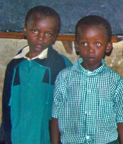 Two children of the 300 who Sister Jane Ann feeds lunch to daily